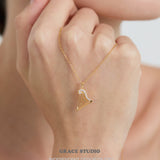Crystal Accented Harp Pendant Necklace