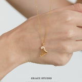 Crystal Accented Harp Pendant Necklace