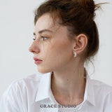 Molten Crescent Mini Hoop Earrings