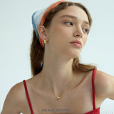 Orbit Pearl Stud Earrings