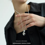 Crater Pearl Long Pendant Necklace