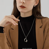 Molten Curve Pendant Necklace
