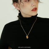Molten Pearl Face Pendant Necklace