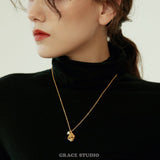 Molten Pearl Face Pendant Necklace
