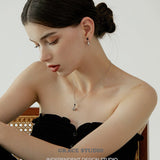 Silver Flask Pendant Necklace with Black Resin Ball