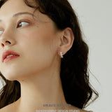 Triple Zircon Cluster Gold Huggie Earrings