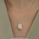 Molten Frame Pearl Pendant Necklace