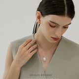 Molten Frame Pearl Pendant Necklace