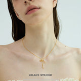 Ribbon Twist Pendant Necklace