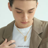 Interlock Oval Bar Pendant Necklace