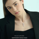 Interlock Oval Bar Pendant Necklace