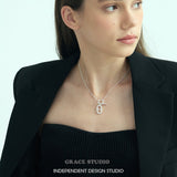Interlock Oval Bar Pendant Necklace