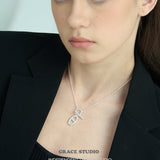 Interlock Oval Bar Pendant Necklace
