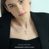 Interlock Oval Bar Pendant Necklace
